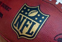 NFL Star Wades Into DCF Custody Inferno Close-up of an NFL football with the logo prominently displayed