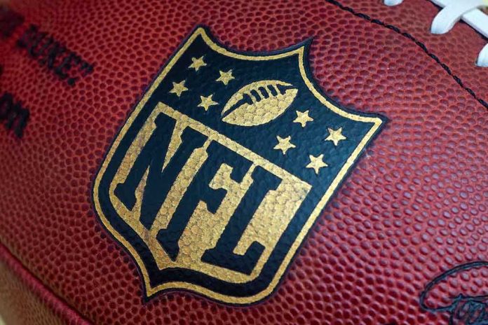 shutterstock_212182807 Close-up of an NFL football with the logo prominently displayed