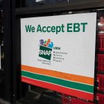 storefront sign stating EBT accepted