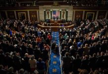 Senate Brawl Erupts Over Jack Smith Legislative chamber audience stands and applauds
