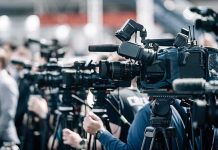 High School Coach ARRESTED – Player Makes Shocking Discovery Broadcast cameras on tripods at a press event