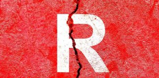 Letter R on cracked red wall