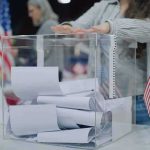 Red-State PASSES Bill To Amend It’s Constitution! Person casting a ballot into a clear box at a polling station