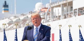 Hospitals Strike Deal With Trump – GAMECHANGER! Donald Trump speaking at a podium with American flags and a ship in the background