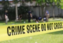 Midnight Chaos: Teens GUNNED DOWN crime scene tape cordoning off a grassy area