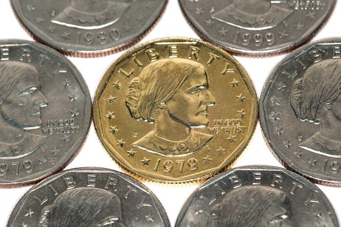 shutterstock_3478782 A collection of coins featuring a gold coin surrounded by silver coins
