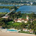Cocaine Cash Taints Kushner Resort Deal Aerial view of a waterfront estate with pool, lawns, and palm trees
