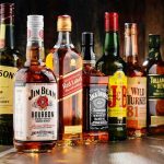 Trump’s Irish Whiskey Announcement Ignites Raucous Applause Assorted whiskey bottles arranged on a wooden surface