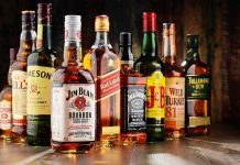 Trump’s Irish Whiskey Announcement Ignites Raucous Applause Assorted whiskey bottles arranged on a wooden surface