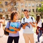 Student ARRESTED – Racist Bomb Note Terrorizes Campus! College students walking on campus with books and backpacks