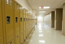 ICE Sends Illegal Alien Who Assaulted High School Girls Packing Row of yellow school lockers in an empty hallway