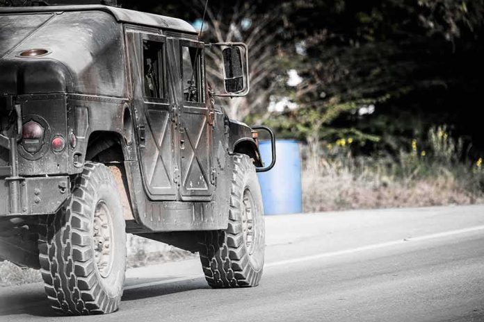 Military vehicle driving on a rural road
