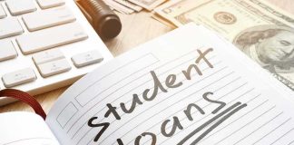 Trump Orders Debt Collectors To Seize Wages From 10 Million Student Loan Defaulters Notebook with student loans written, marker, cash, and keyboard