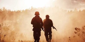 Marines Create New Corp, First One Ever Two soldiers walking through a smoky field at sunset