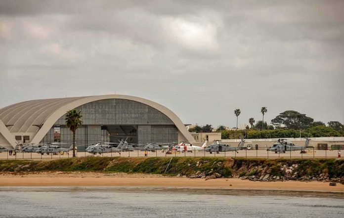shutterstock_1086141389 airport hangar with helicopters near a shoreline