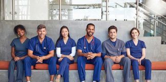 Group of medical professionals sitting on a bench