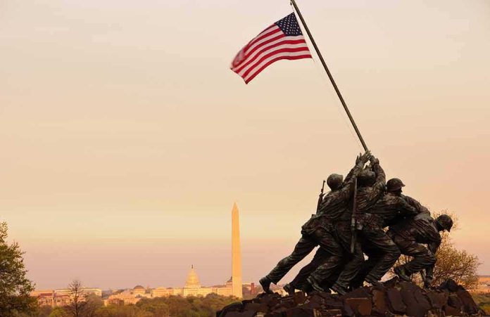 shutterstock_126383276 Iwo Jima Memorial with soldiers raising the American flag at sunset