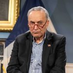 Schumer Tucks Tail and Runs When Faced With Tax Question Charles Ellis Schumer wearing red glasses and a dark blazer