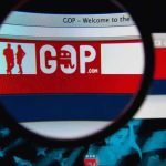 To Win the Midterms, Should MAGA Should Fund a Pro-Iran? Magnifying glass focusing on GOP website banner