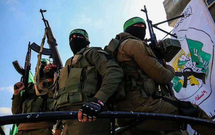 armed masked men in military gear holding rifles