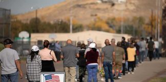 Black Voters DESTROY Obama During Rally voters standing in a long line outside a polling place