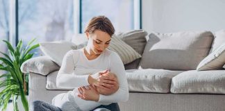 Gay Dad Viciously Mocks Baby Trying to Breastfeed Mother breastfeeding baby on living room floor