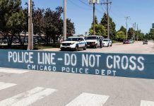 HORROR: 7-Year-Old Girl Fatally Stabbed in the Back by Stranger Police line barrier blocking a street with patrol vehicles behind