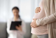 Man Murders Girlfriend and Unborn Baby In Most Horrific Way Pregnant woman holding belly during medical visit