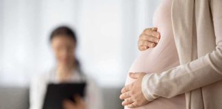Man Murders Girlfriend and Unborn Baby In Most Horrific Way Pregnant woman holding belly during medical visit
