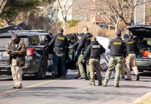 Cops Reveal Chilling Detail in Missing Teen Case Police and sheriff officers gather around vehicles on a suburban street