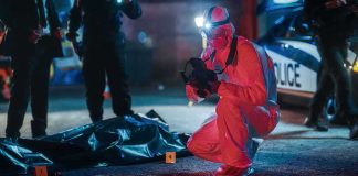 Man Who Blamed ICE for Wife’s Disappearance Charged with Murder forensic investigator photographs crime scene evidence at night