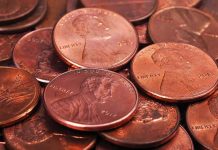 Penny Axed, Next Coin is on the Line pile of copper pennies with heads side up