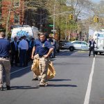 Illegal Alien Wanted For STABBING Cop in Daylight Attack Police officers and investigators at a blocked city street scene