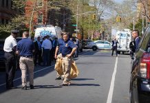 Illegal Alien Wanted For STABBING Cop in Daylight Attack Police officers and investigators at a blocked city street scene