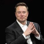 Pentagon Assigns Musk TOP Military Role, Even Gives Him an Office Elon Musk seated in a black suit with hands clasped