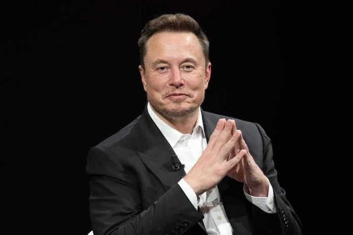 shutterstock_2318800323 Elon Musk seated in a black suit with hands clasped