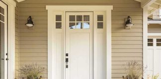 Creep Wearing Biden Mask Terrifies Residents white front door with sidelights and planters