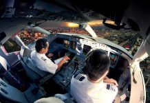 Video Leaked Of Israeli Hijacker Cockpit Brawl Pilots in an airplane cockpit during city approach at sunset