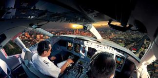 Video Leaked Of Israeli Hijacker Cockpit Brawl Pilots in an airplane cockpit during city approach at sunset